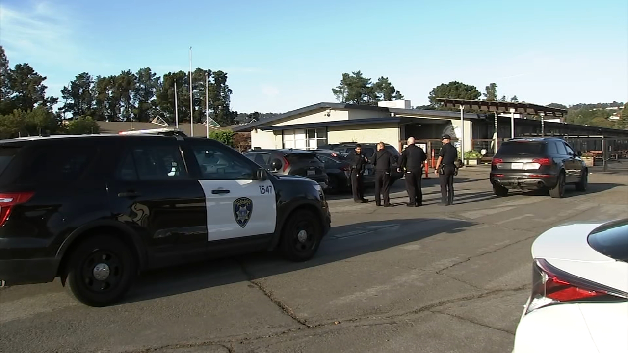 School parking lot with children and parents, emphasizing safety and community vigilance.